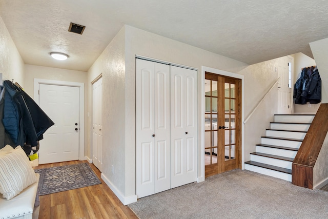 entryway featuring a textured ceiling