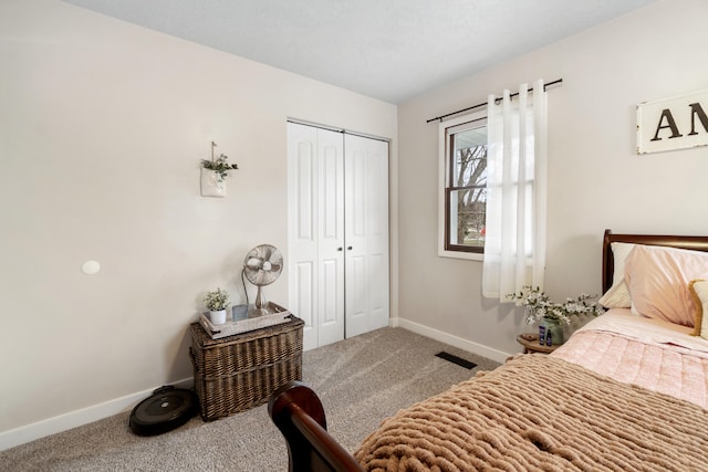 carpeted bedroom featuring a closet