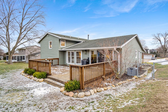 back of property with a wooden deck