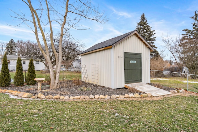 view of outbuilding featuring a yard