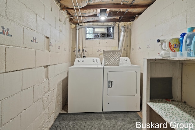 washroom featuring laundry area and washer and dryer