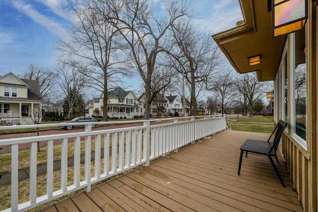 wooden terrace with a residential view