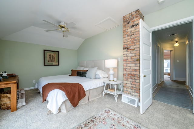 bedroom with lofted ceiling, attic access, a ceiling fan, light carpet, and baseboards