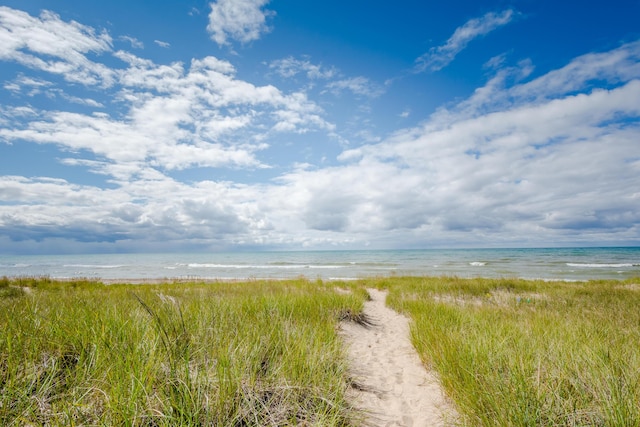 property view of water featuring a beach view