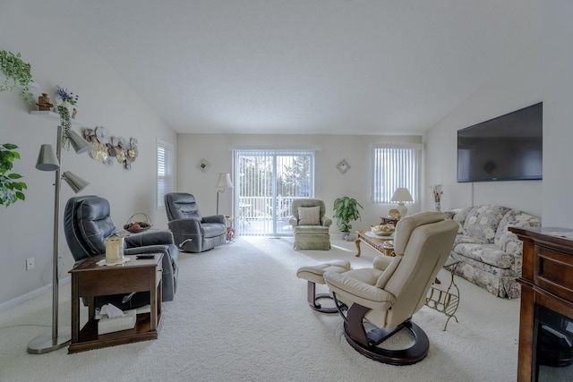 living room with lofted ceiling and carpet