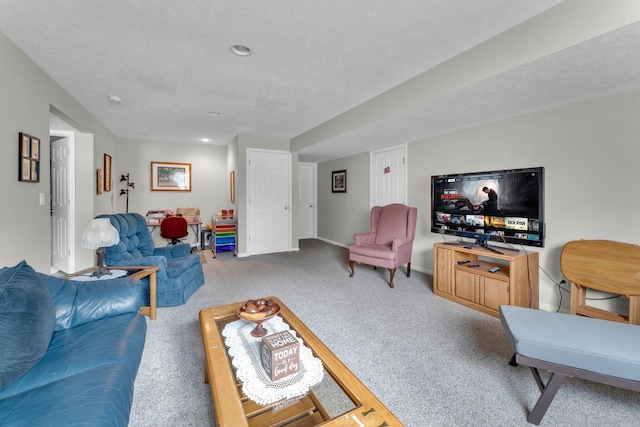 living room featuring carpet floors and a textured ceiling