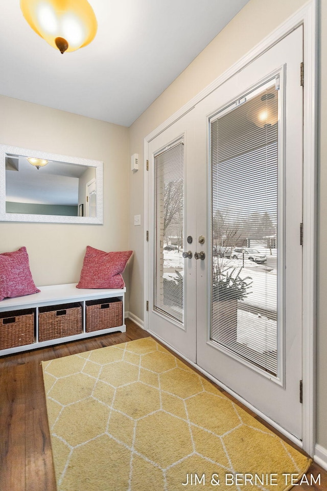 mudroom with a healthy amount of sunlight, hardwood / wood-style floors, and french doors