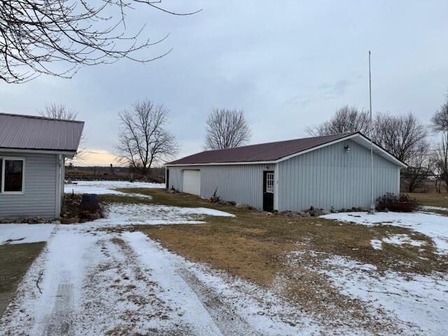 view of snow covered garage