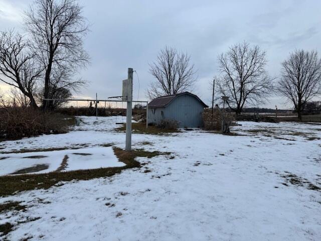 view of yard covered in snow