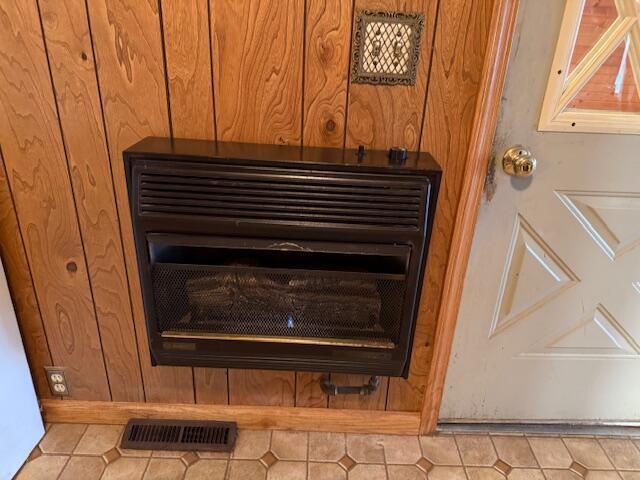 details with wooden walls and heating unit