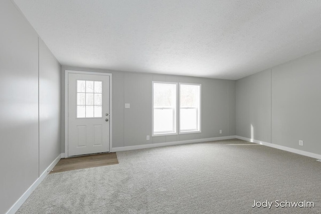 interior space with a textured ceiling