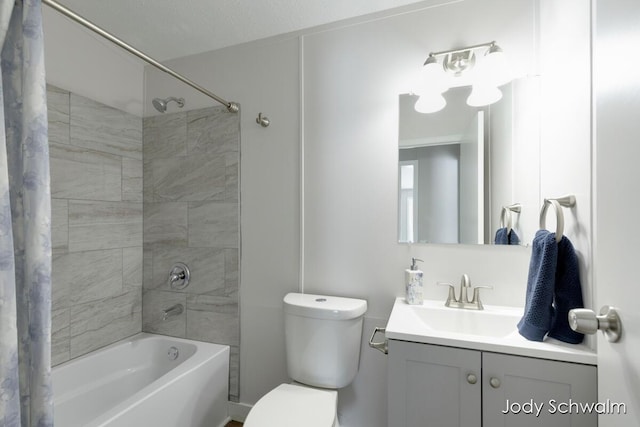 full bathroom featuring vanity, shower / bath combo, and toilet