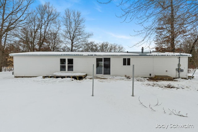 view of snow covered house