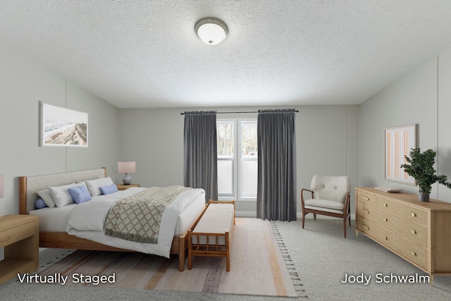 bedroom featuring lofted ceiling, a textured ceiling, and carpet