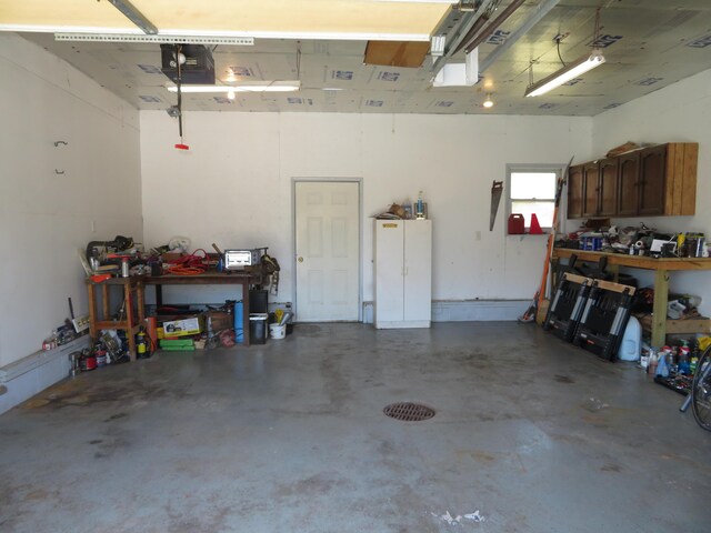 606 Wall St, Eastlake, MI 49626 - garage featuring a workshop area and a garage door opener