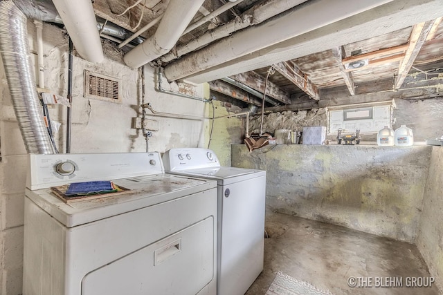 laundry room with washer and dryer