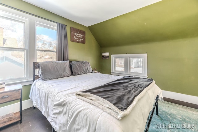 bedroom with lofted ceiling