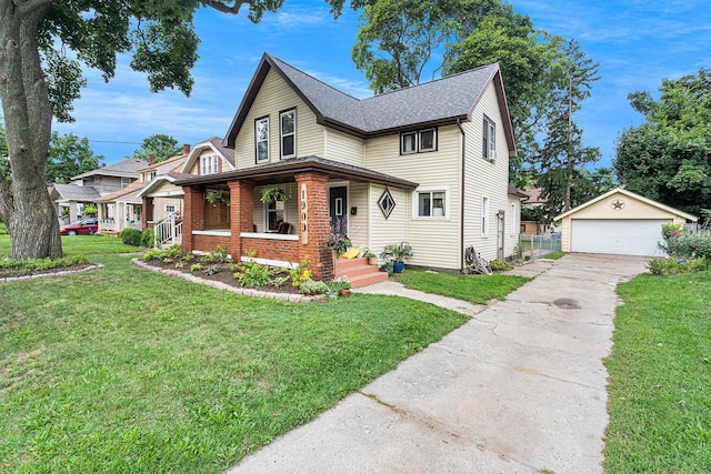 view of front facade featuring an outbuilding, a garage, a front lawn, and a porch