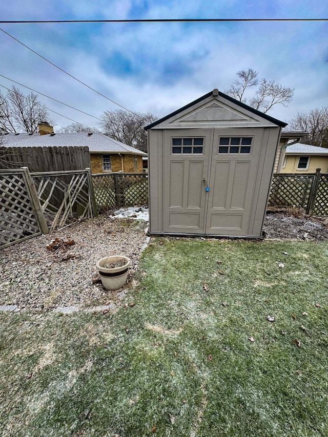 view of outbuilding with a lawn