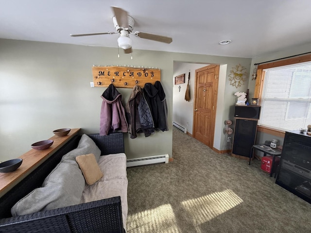 carpeted bedroom with a baseboard radiator and ceiling fan