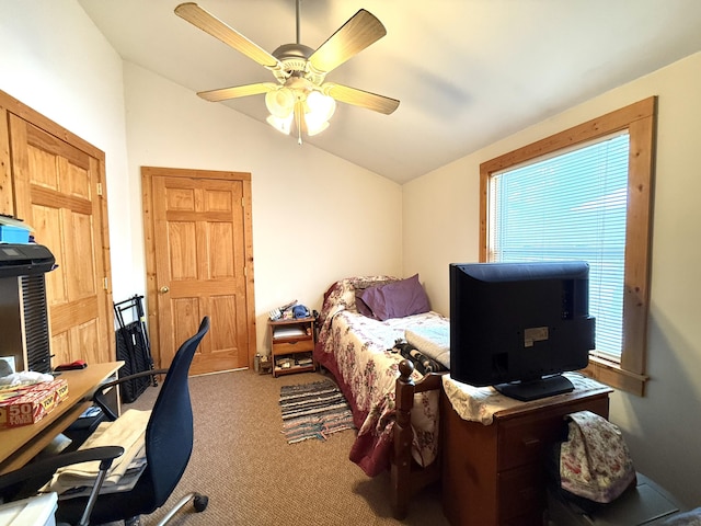 carpeted bedroom featuring vaulted ceiling and ceiling fan