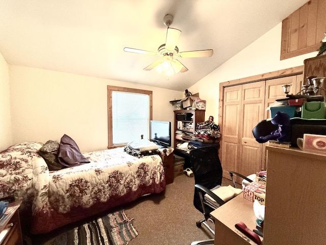 bedroom featuring lofted ceiling, a closet, ceiling fan, and carpet