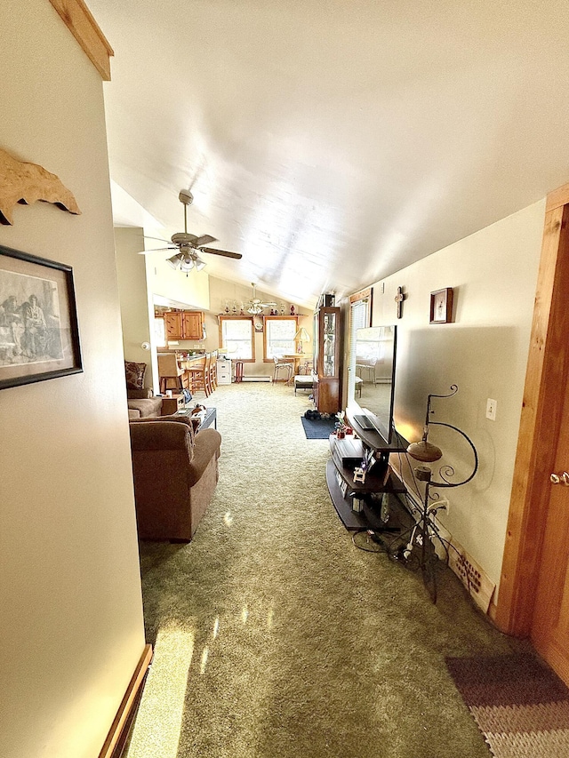 carpeted living room featuring ceiling fan and vaulted ceiling