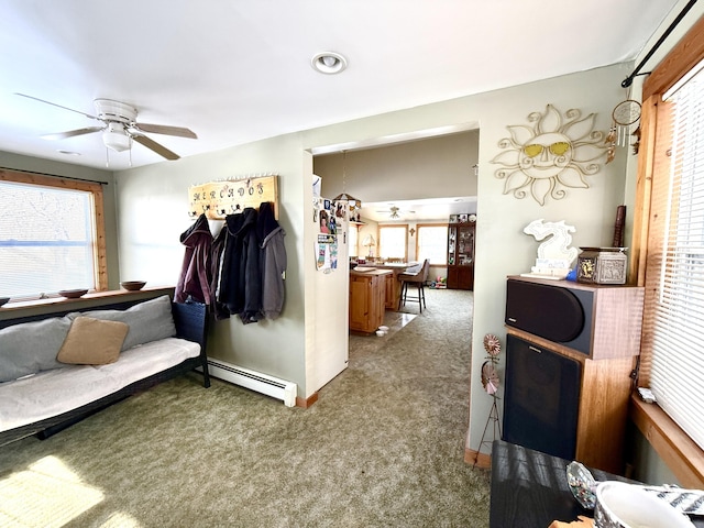 bedroom with carpet flooring, ceiling fan, and baseboard heating