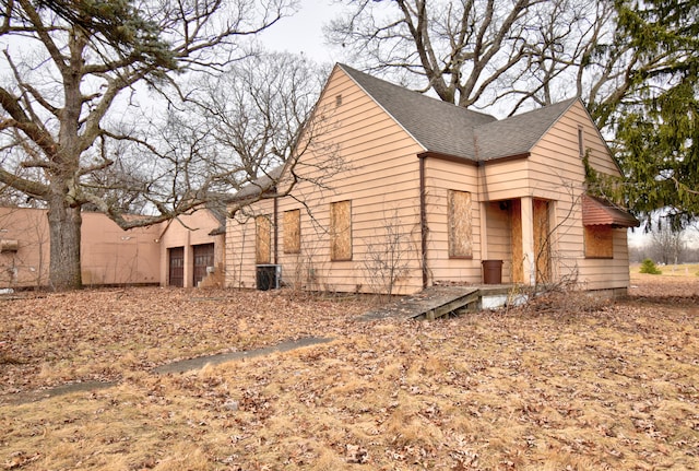 view of home's exterior with central AC