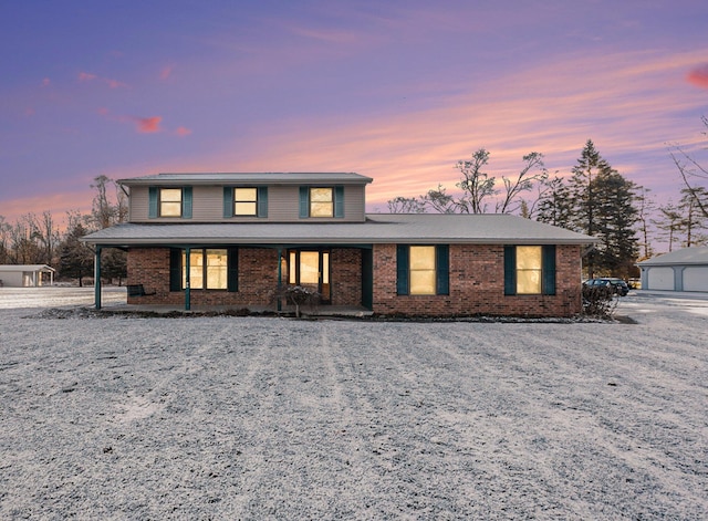 view of property featuring a garage and an outdoor structure