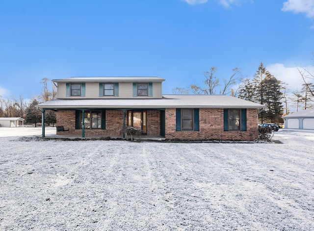 view of front property with a garage and a porch