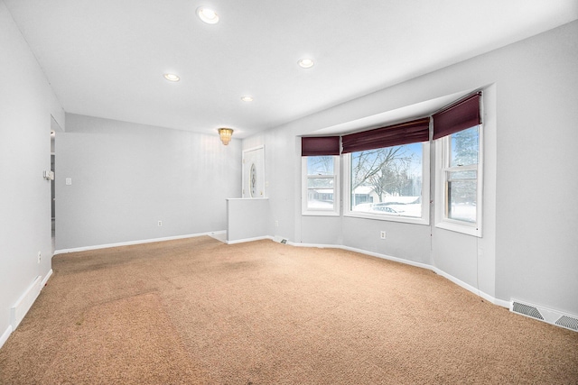 unfurnished room featuring carpet flooring