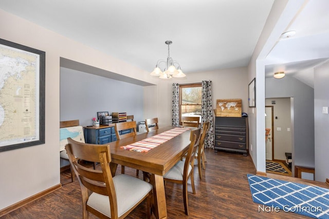 dining space featuring an inviting chandelier and dark hardwood / wood-style floors