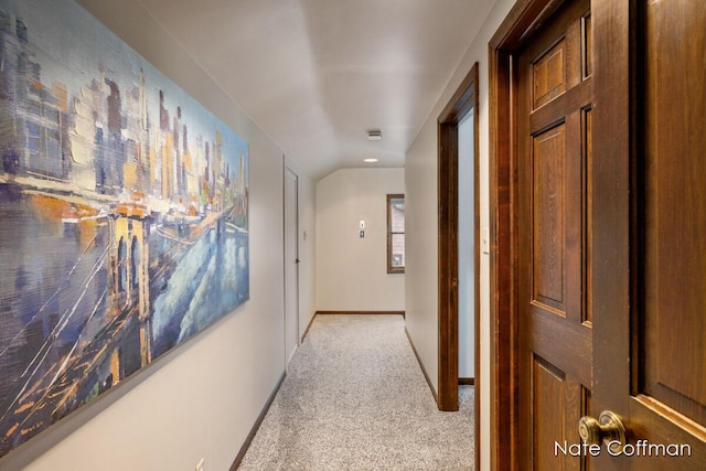 hallway with light colored carpet