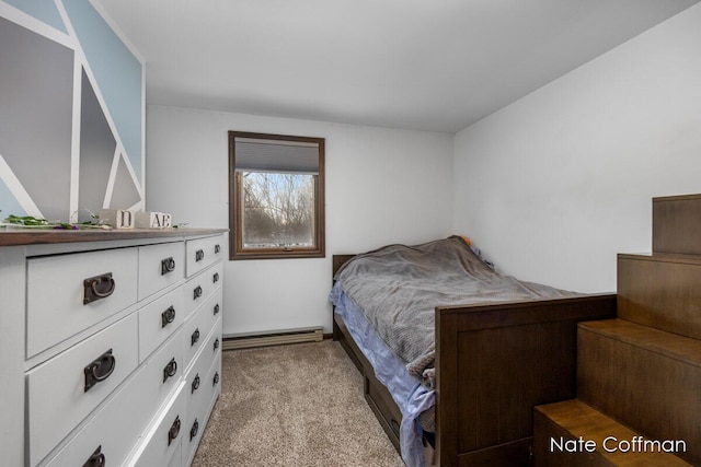 bedroom with light carpet and baseboard heating