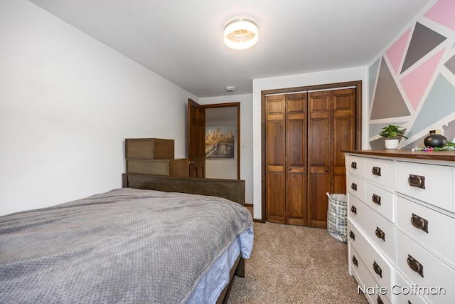 bedroom featuring light carpet and a closet