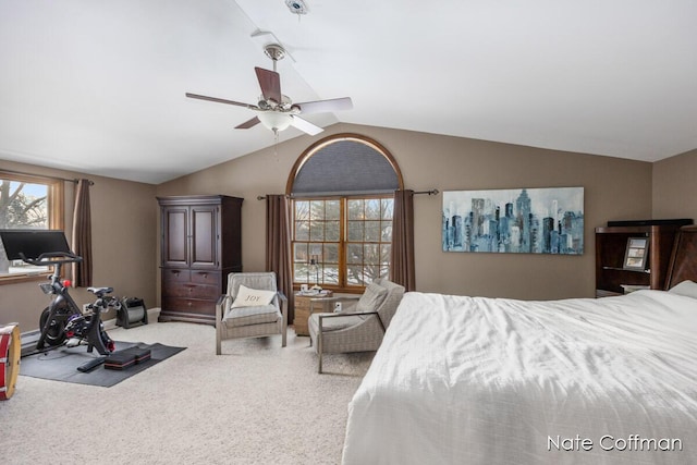 bedroom featuring lofted ceiling, light colored carpet, and ceiling fan