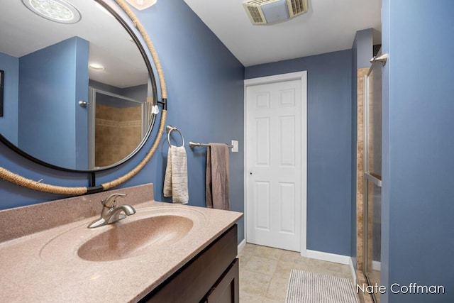 bathroom featuring vanity and a shower