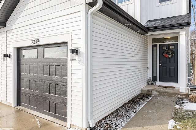 property entrance with a garage