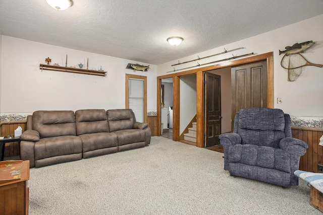 living room featuring carpet flooring and a textured ceiling