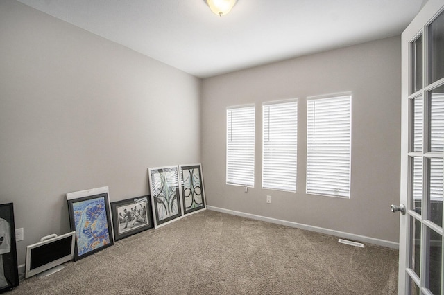 view of carpeted spare room