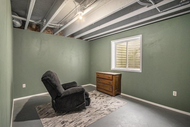 living area with concrete flooring