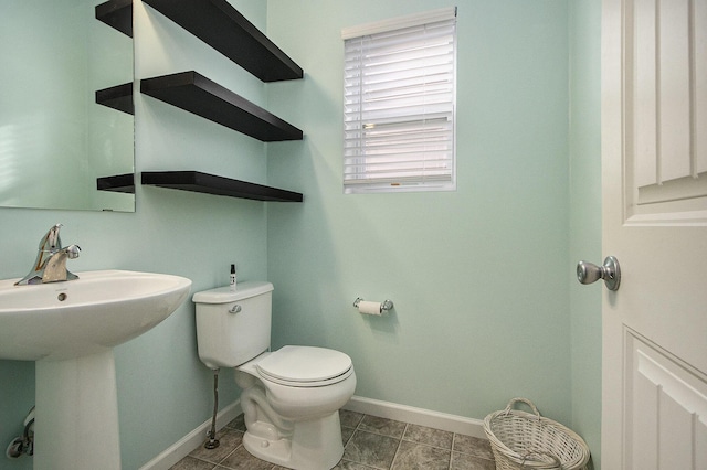 bathroom with toilet and sink