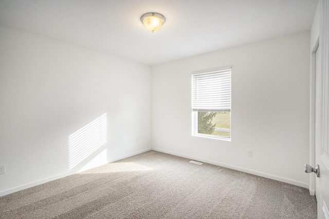 empty room with carpet flooring