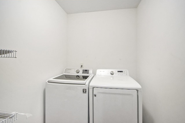 laundry area with independent washer and dryer