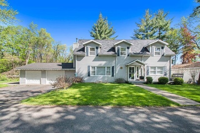 cape cod house with a garage and a front yard