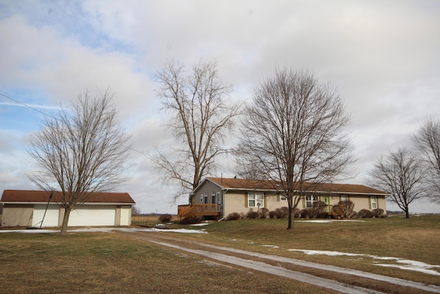 ranch-style house with a garage and a front yard