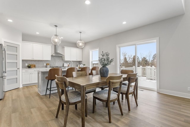 dining space featuring light hardwood / wood-style floors