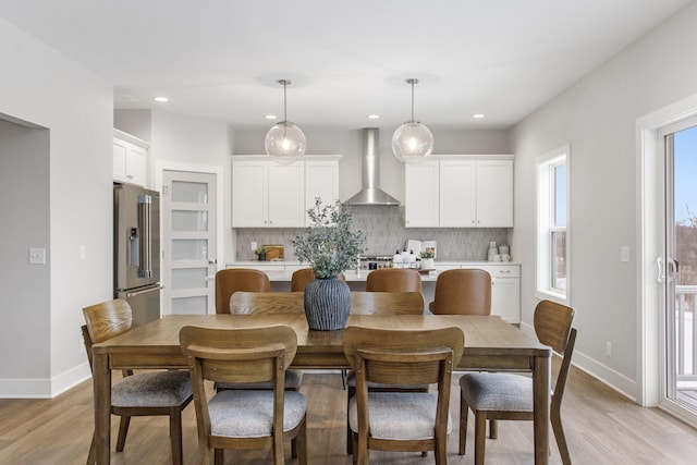 dining area featuring light wood-type flooring