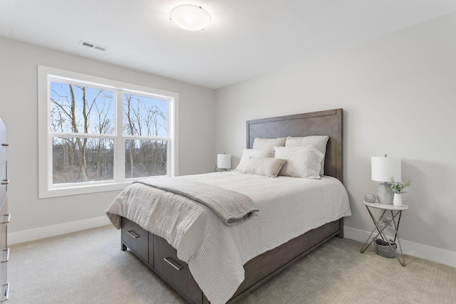 bedroom featuring light carpet